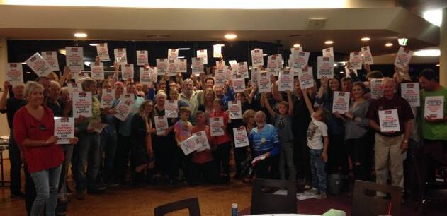 At MBGALAC’s Open Tournament Dinner people gathered and held up  “Stop the Trawler" posters. 