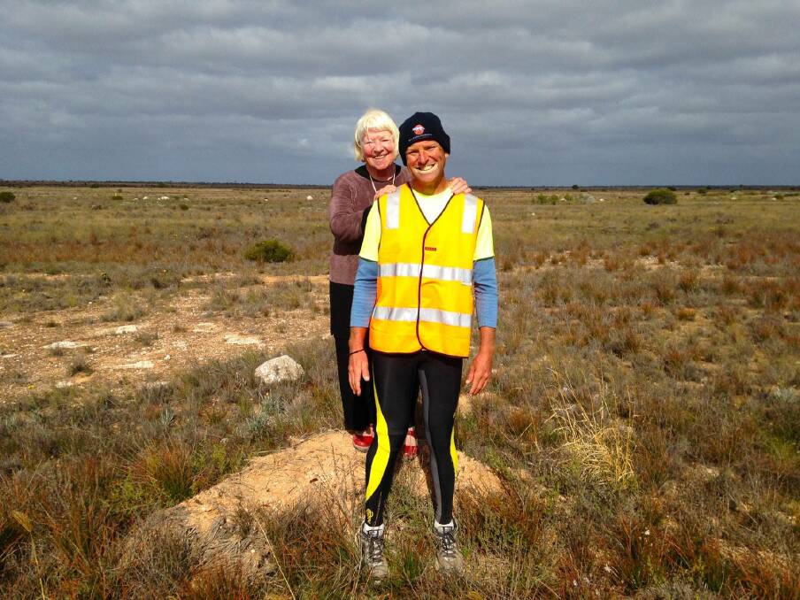 Running with a smile: Dane Waites was very happy to celebrate his mum Junee's birthday on Monday as he was in the middle of his long run across the Nullarbor on his way back to Pambula. 
