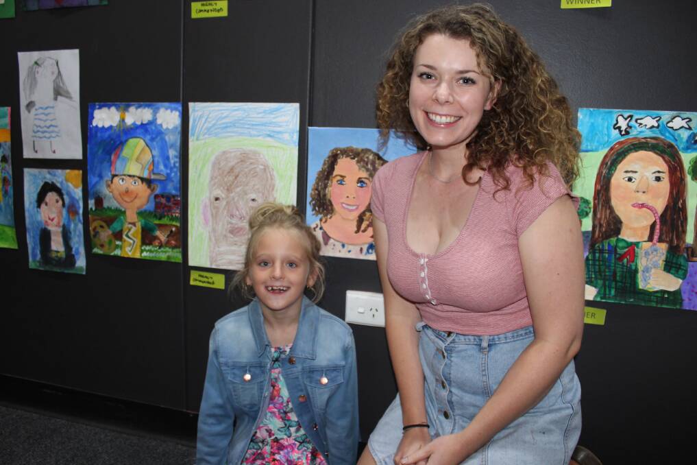 Alexandra Matravers and Chrystal Rimmer with Alexandra's Young Archie entry at Friday's opening of the Archibald Prize Tour at the Bega Valley Regional Gallery.