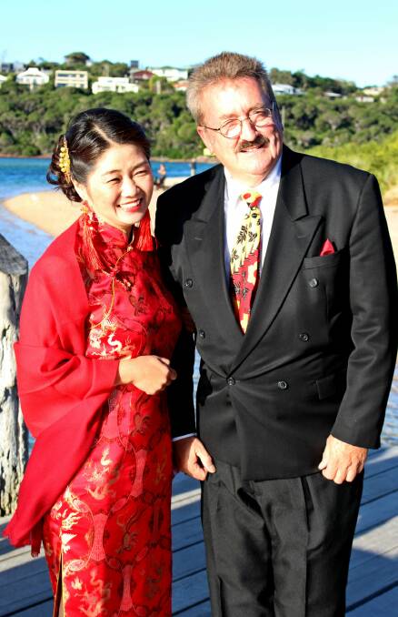 Tying the knot: Alan Malard with his new wife Mei Mei at their wedding at Mitchies Jetty on Thursday, May 19.