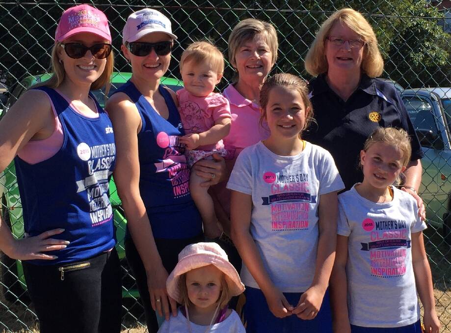Family affair: Merimbula Mother's Day Classic organisers and their family enjoy a fun and friendly morning to raise money for breast cancer research at the 2015 event. 