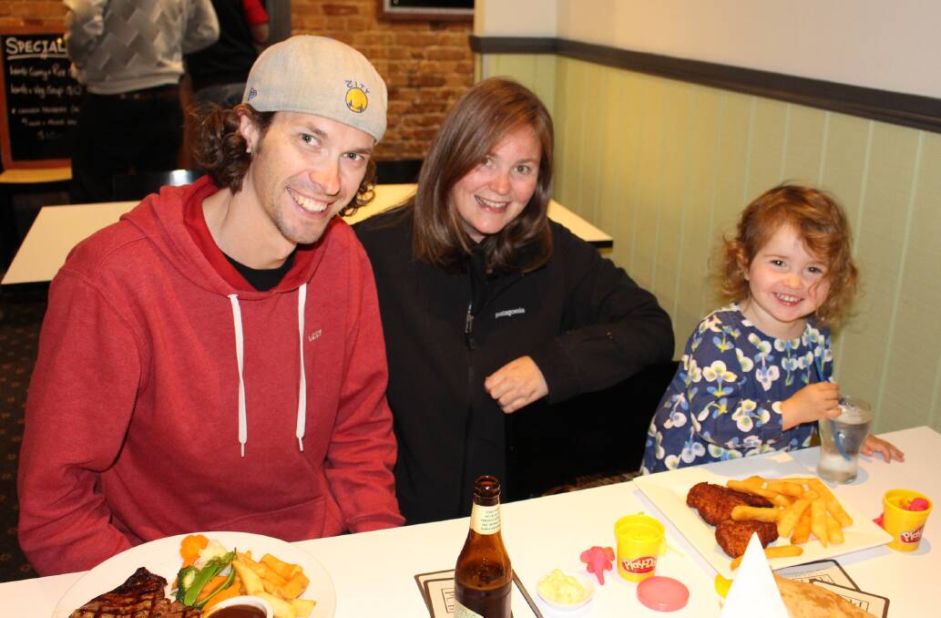 Luc, Leah and two year old Harriet McKay enjoy a night out and a good meal at the Top Pub in Pambula.