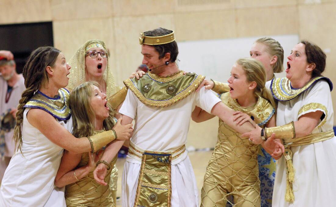 ‘Joseph’, played by Jesse Zammit, being swarmed by a group of Egyptian maidens Patricia Mills, Carole Skillicorn, Eilleen Reckord, Lillian McViety, Madeline Pettigrove-Barr and Candy McViety  during a scene from Joseph and the Amazing Technicolour Dreamcoat. 