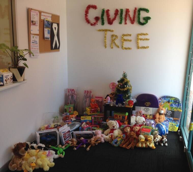 The growing pile of gifts under the Merimbula News Weekly office Christmas tree destined for the region's disadvantaged children and families.