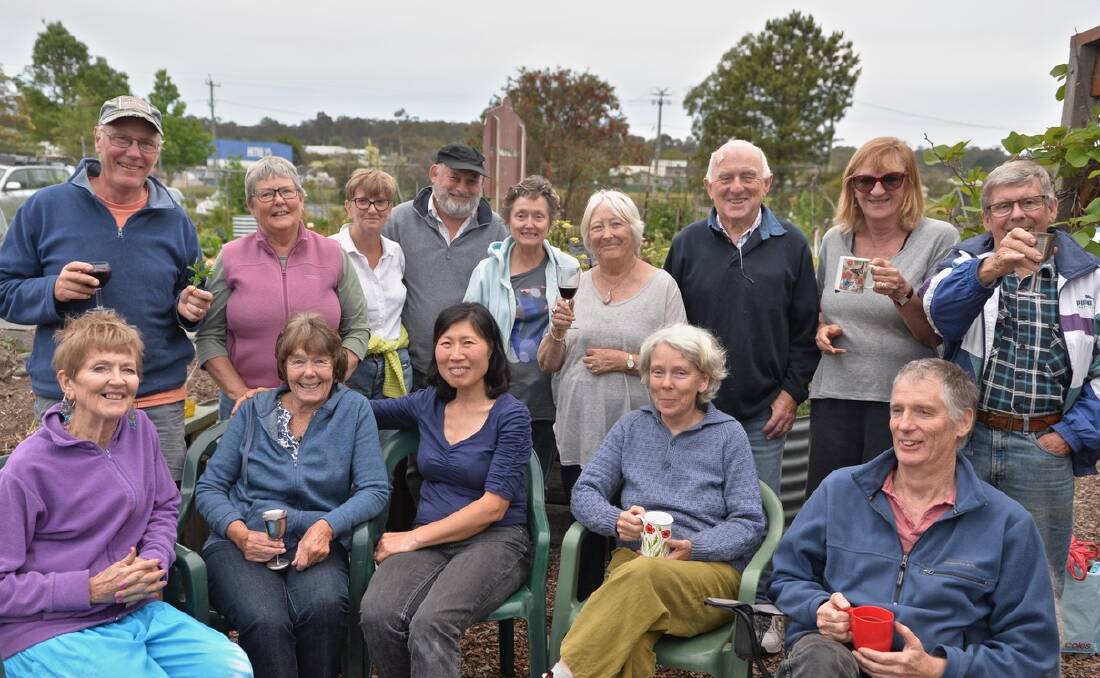 Community spirit: Gardeners and friends at the Pambula Village Community Garden enjoying a recent party in the garden to celebrate the end of year. Picture: Colin Dunn