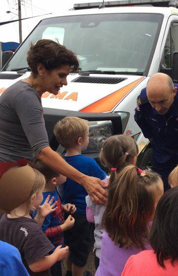 The kids at Little Nippers Early Learning Centre meet paramedic Chris Branson and check out the ambulance. 