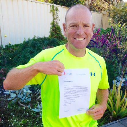 Dane Waites proudly holds up the letter he received earlier this month from former Prime Minister Julia Gillard. 