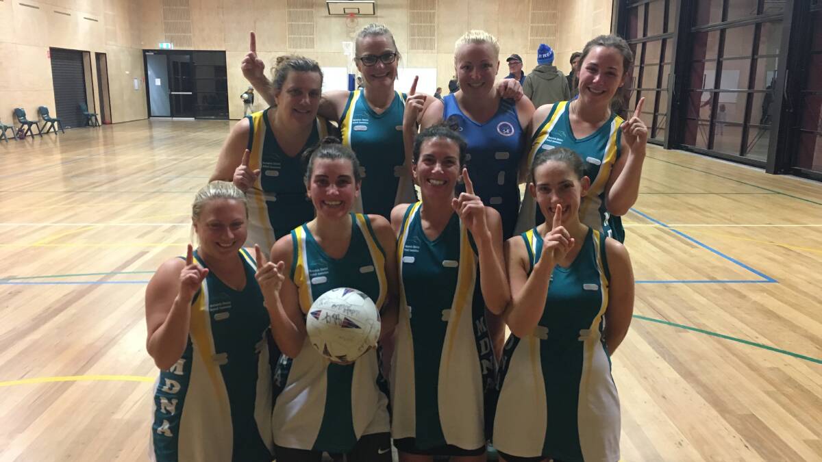 Champions: The Merimbula District Netball Association open winners, the Teal team, celebrate after winning the grand final by one goal on the buzzer. 