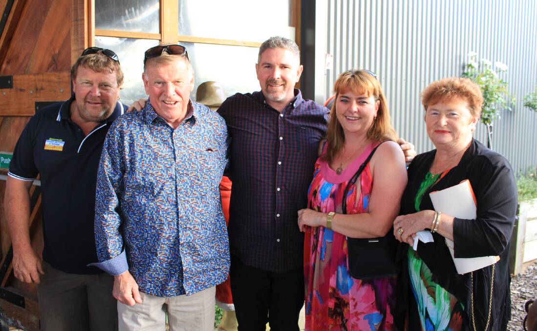 Family: Jason, Robert, Keryn and Karen Smith with Justin Devon (centre) from Robert Smith Homemakers at the Oaklands Christmas party. More picture online. 