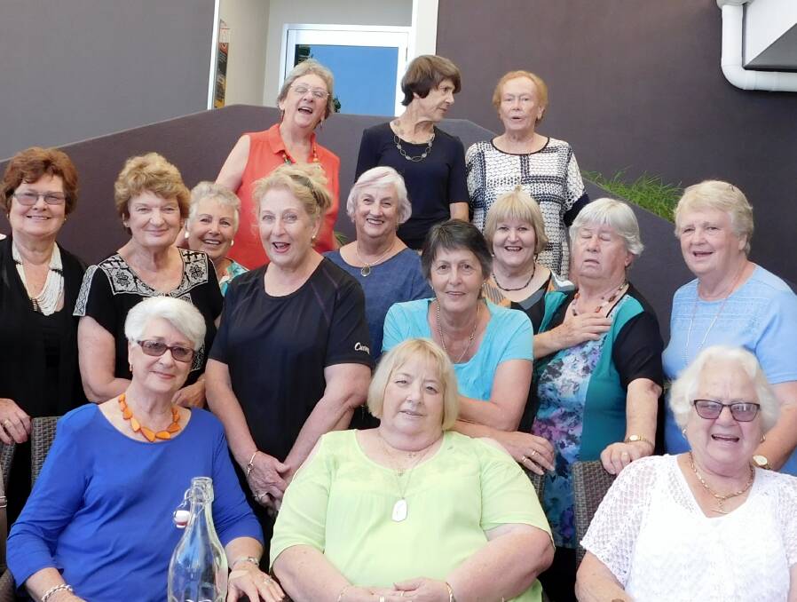 Farewell: Gwen Scorgie in the front row in sapphire blue with many of the Merimbula Evening VIEW Club members who will miss her friendship and active support.