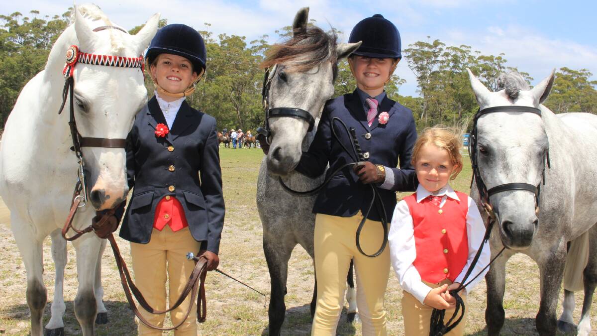 RIDERS: Emerson Armstrong, 10, with pony Eddy, Maddie Cullen, 10, with Barney, and Sienna Jessop, 5, with Ty. 