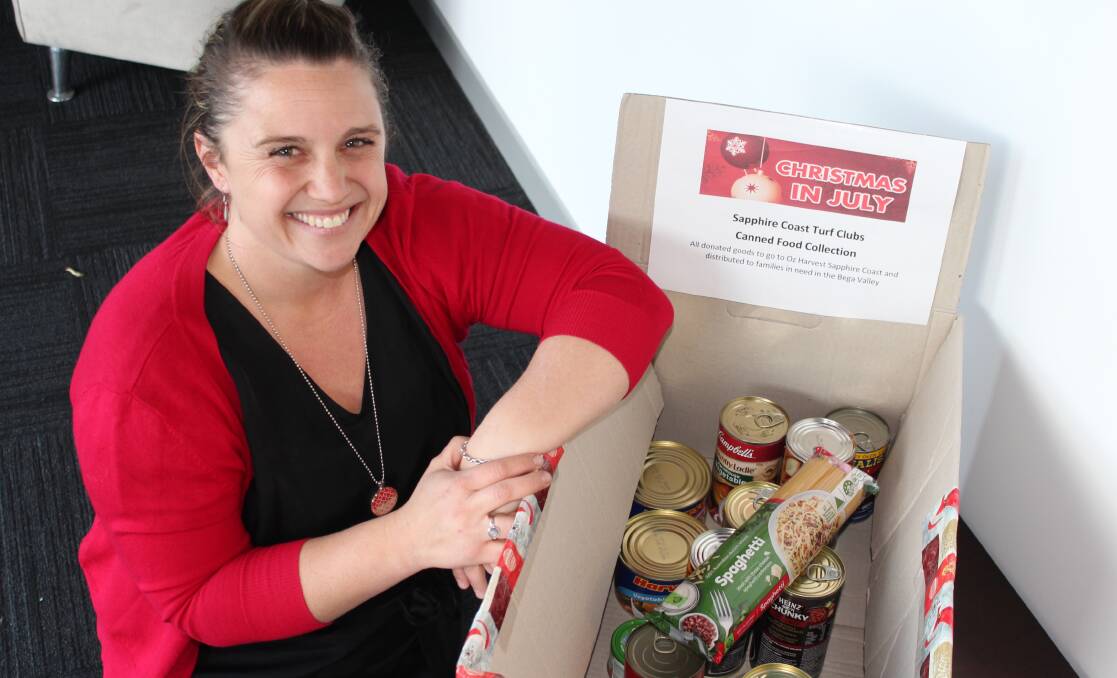Give generously: Jess Ryan with the food drive box located at the Merimbula News Weekly office. Picture: Melanie Leach