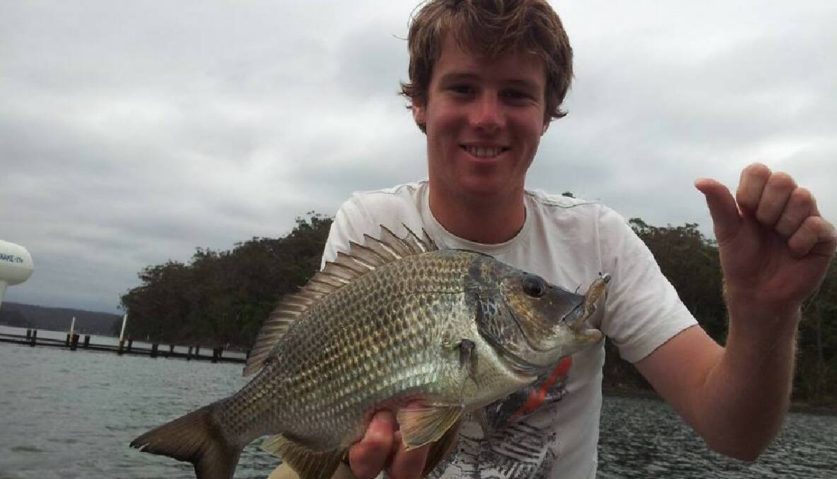 AT IT AGAIN: Fishing duo Nick Cowley and Alex Krantz, pictured with a bream, were at it again getting nice bream and flathead on plastics and poppers on the Wagonga Inlet flats this week. 18/12/2013