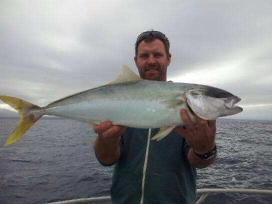 ISLAND KING: Justin from Sydney and his kingie caught on Playstation today. Skipper Nick Cowley reports lots of undersize kingfish but they got his nice legal and also mowies in deep water.  5/1/2104
