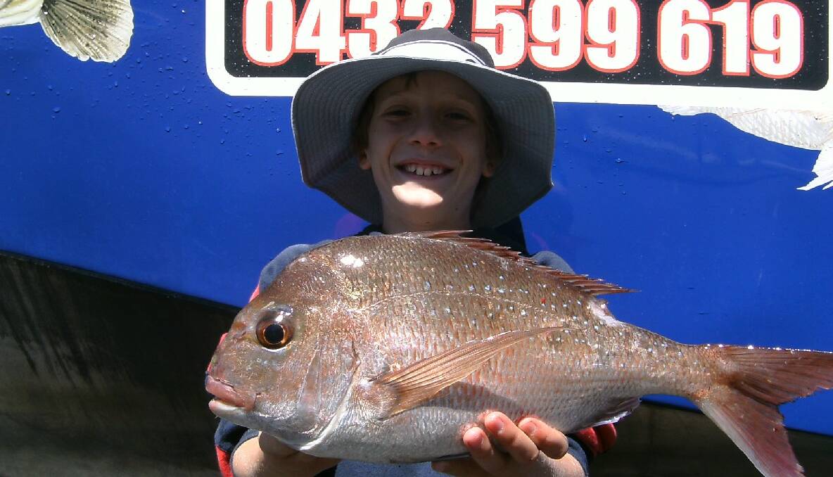 FIRST SNAPPER: Patrick Richardson of Newborough, Victoria with his first ever snapper caught on board Narooma Fishing Charters at Montague Island. 