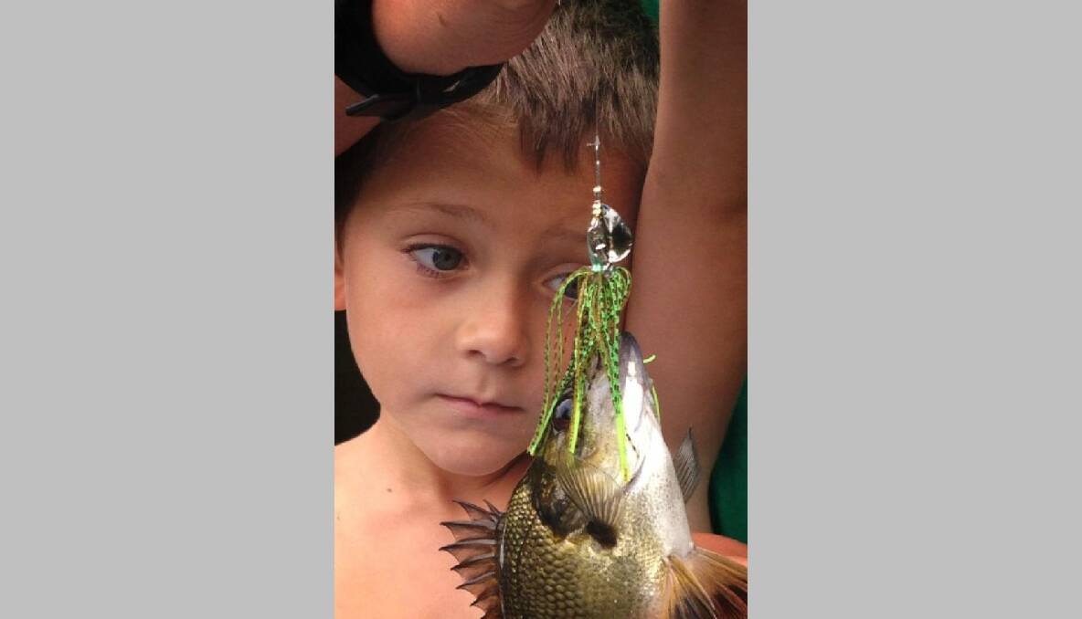 FIRST BASS: Little Noah Mccue of Bermagui with his first bass that he caught with his family on Brogo Dam on the weekend. Well done Noah!  22/1/14