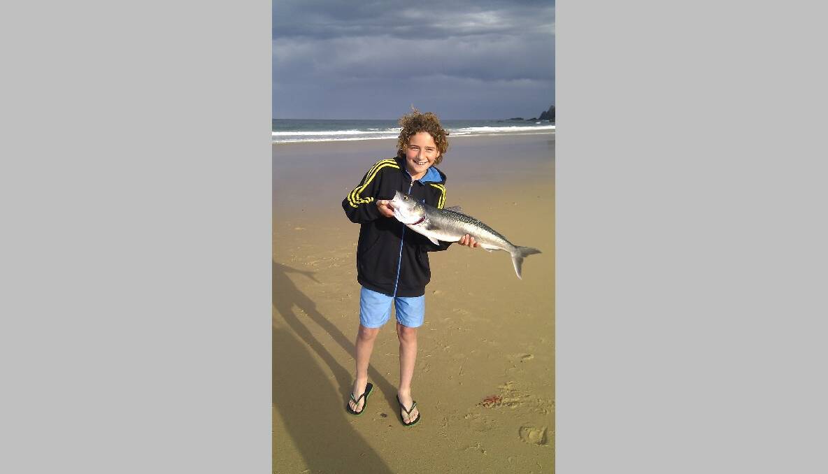 WHOPPER SALMON: Ben and his whopper salmon caught at Narooma’s surf beach. 