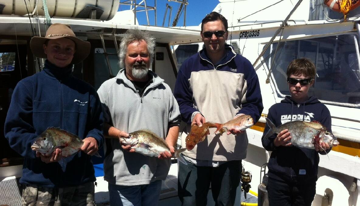 FISHBERMI CHARTER: Happy customers fishing on the Fishbermi.com charter boat on Saturday were Bernie Anderson of Cobargo, Danny and Ben Kaye from Bemboka and Paul Sliwinski from Queanbeyan. (30/10/2013) 