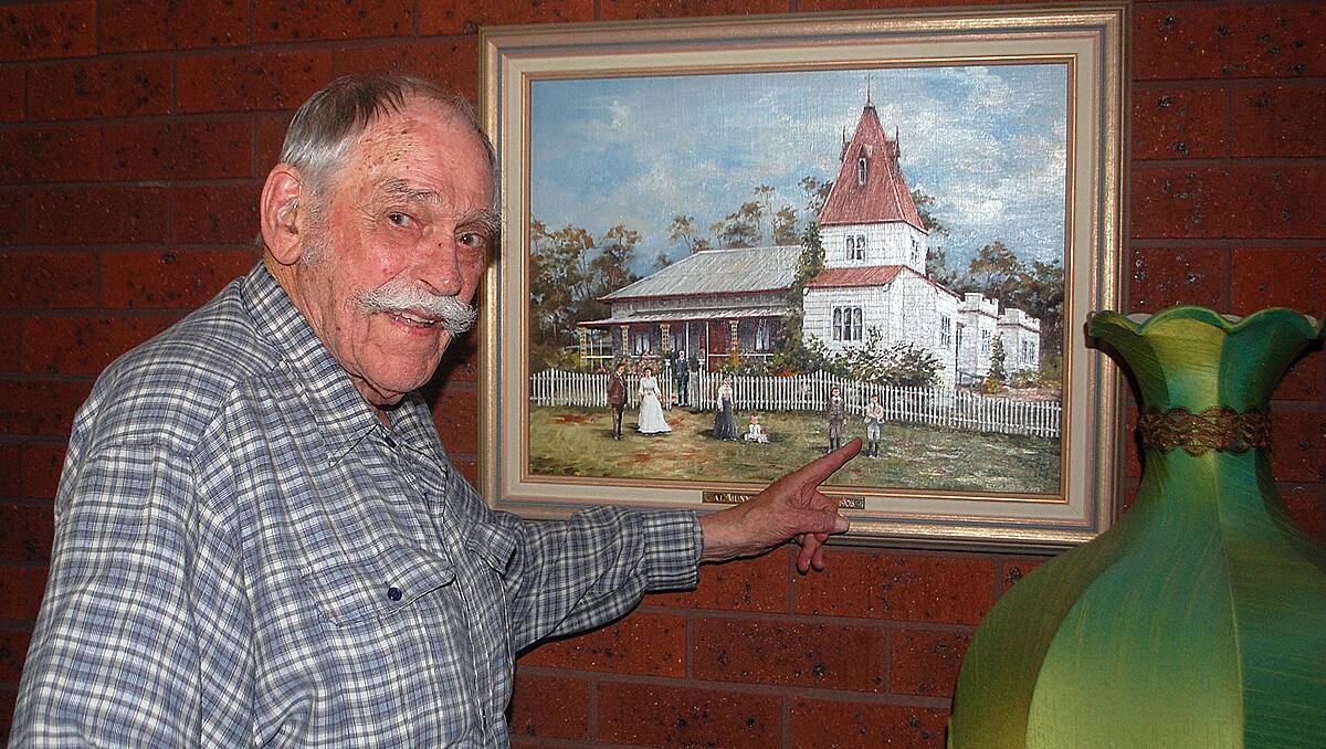 • Chappie Munn with the painting of Courunga Tower, the family home.