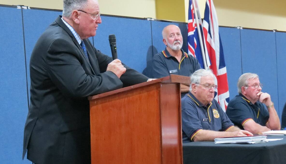 ClubsNSW president Peter Newell, left, RSL president and Sub-branch treasurer Graeme Williams, Sub-branch president Doug Beaumont (standing) and Sub-branch secretary Tony Toussaint at the Merimbula RSL Sub-branch meeting. 