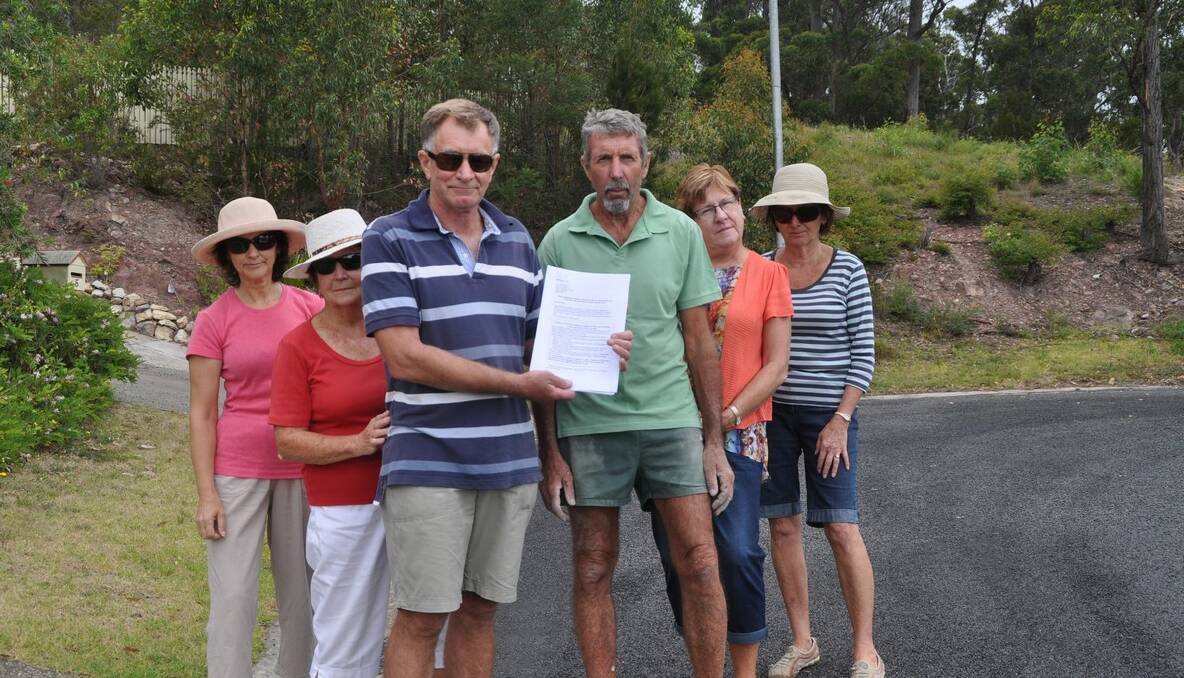 Angry residents Cathie Isaac, left, Patricia Little, Geoff Miller, Phil Hall, Lyn Hall and Helen Miller with the petition that was delivered to council.