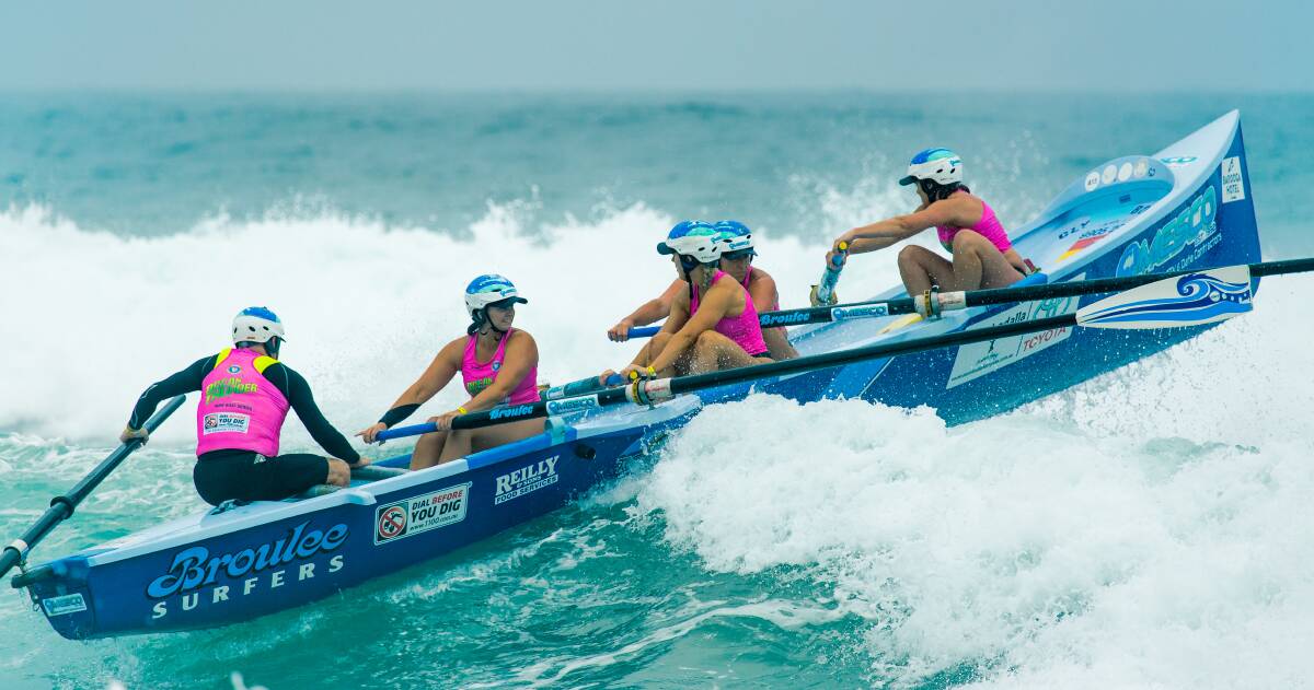 Broulee's Women's Ocean Thunder rowing team in action last season. The team included two Pambula SLSC members. Photo: Paul Carter, carter_capture photography 