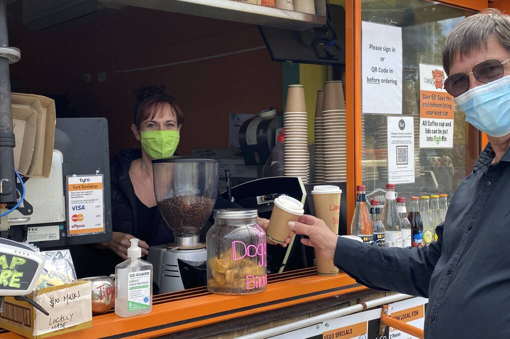 FRIENDLY FACES: Cranky Café employee Trish Lavender serves customer Ken Vatcher his takeaway coffee on Tuesday, October 12. Photo: supplied 
