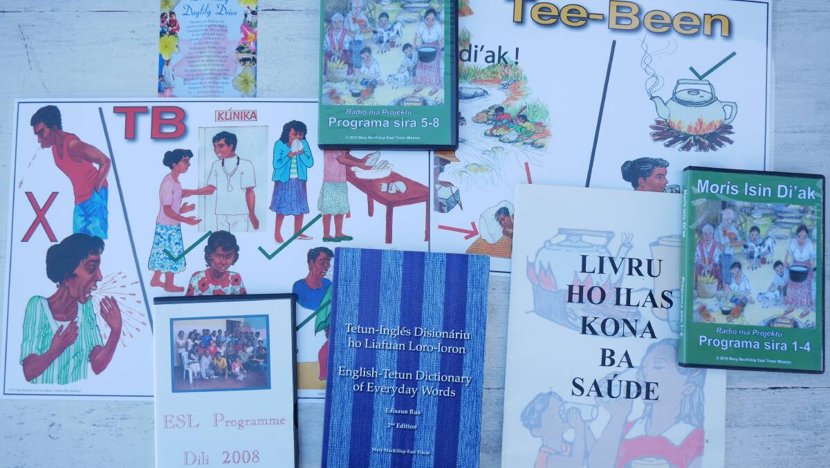 A collection of educational resources Ms Taylor helped create or publish that were distributed around Timor to assist with disseminating vital health information. Photo: Ellouise Bailey