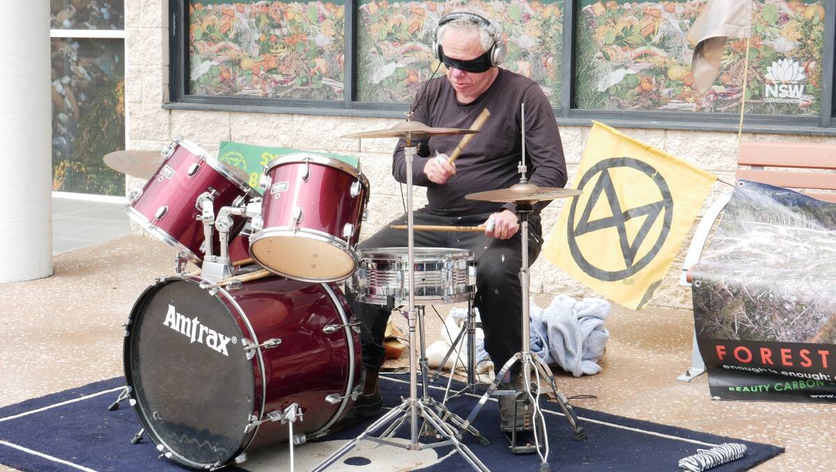 The Lone Drummer set up his drum set outside of the Bega Valley Shire Council to draw attention to the action. Picture: Ellouise Bailey 