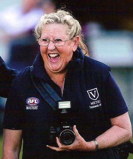 Shirley Rixon during her time as a volunteer photographer at the AFL Masters National Carnivals. 