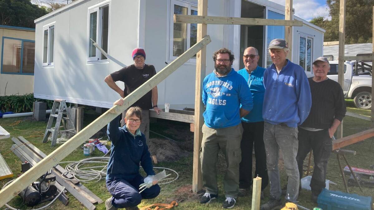 FROM LEFT: Volunteers Sara Williams, Scott Lipsham, Justin Short, Hugo White, Mark Smith, and Bill Foxwell donate their time to help install the Social Justice Advocatees housing units at Pambula. Photo: supplied 