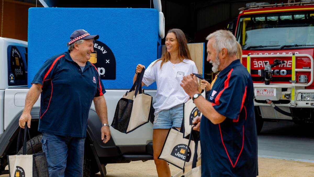 Co-founder/directors Eleanor Baillieu and Erin Boutros give collected goods to frontline CFA firefighters who defended Mallacoota during the fires that claimed 100 homes and the lives of two people. Picture supplied