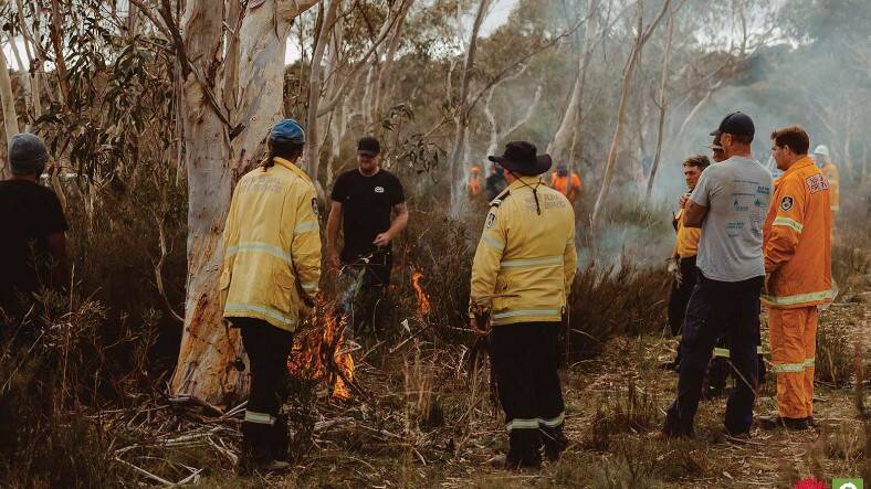 Batemans Bay Local Aboriginal Land Council ranger coordinator Andrew White performing a cultural burn. Picture: supplied