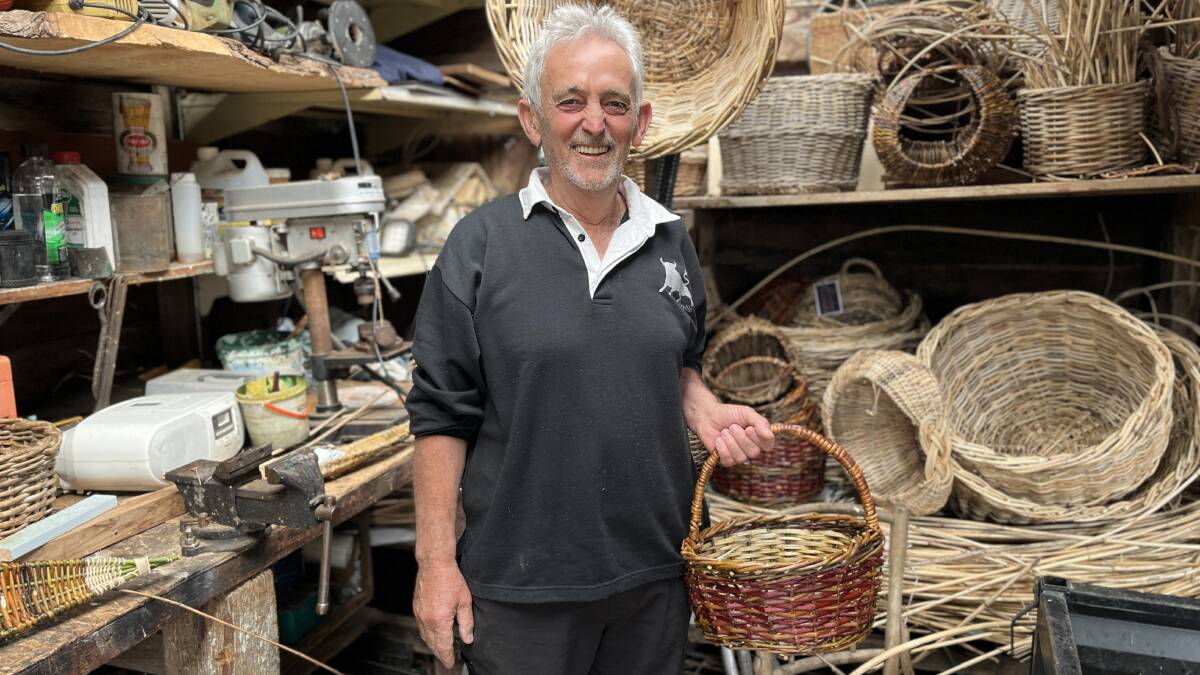 Bob Woszczeiko among a garage filled with weaved baskets. Picture by James Parker