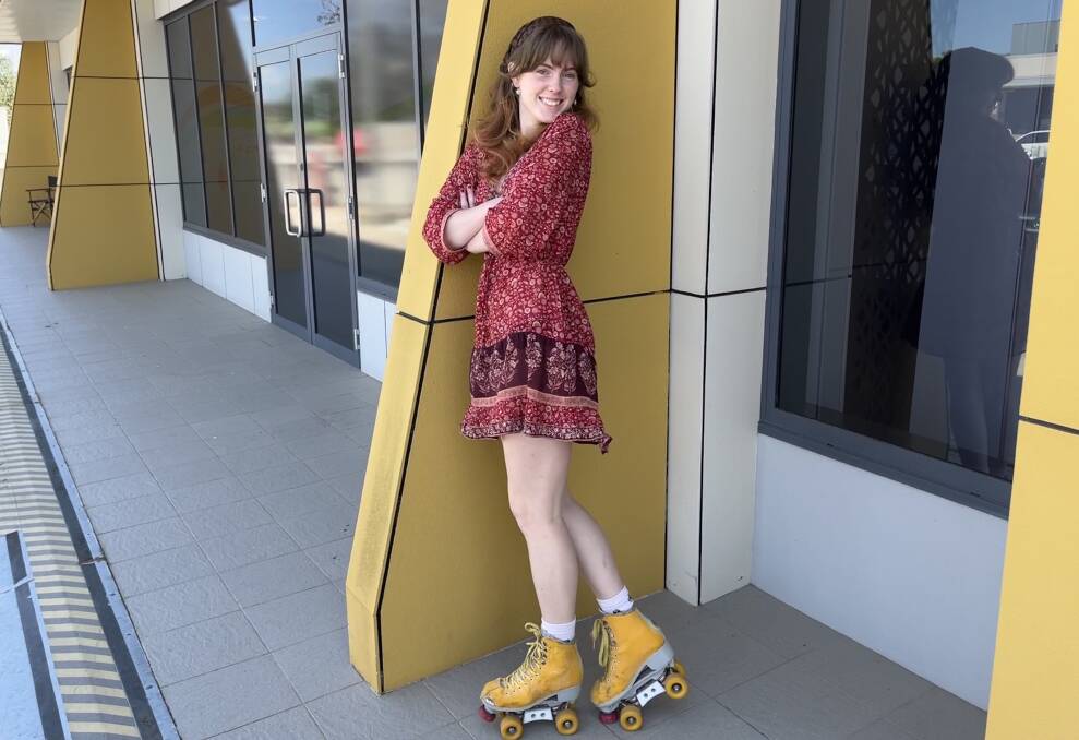 Lilli Simpson outside headspace Bega, her skates coordinating perfectly with the the colour scheme of the exterior. Picture by James Parker