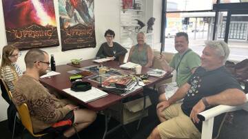 Alice, Luc, Harry, Nadia, Angus and Steve playing Dungeons and Dragons at Tabletop Gaming Hub in Bega. Picture by James Parker