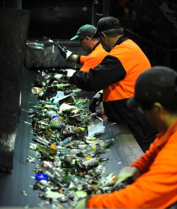 Sorting glass at a Material Recovery Facility. Fairfax file image