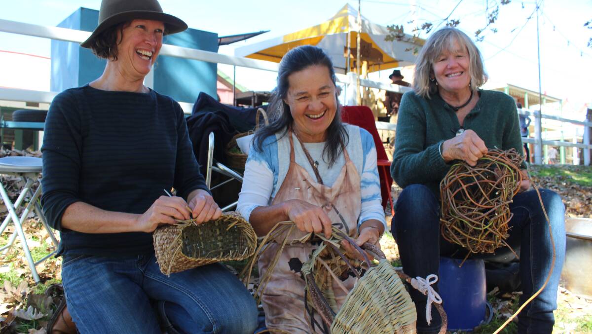 Wyndham Basketweavers Lyndall Robertson, Trish Castillo and Jen King demonstrate their craft at the weekend's Candelo Village Festival.
