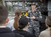 Clearance Diving Officer, Lieutenant Benjamin Morgan speaks with Defence Force Recruiting candidates. Photo: Department of Defence