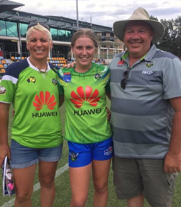 CAPITAL EXPERIENCE: Pambula's Tamika Millard - with her parents Pauline and David - is enjoying her first taste of NRL Under 18s competition with the Canberra Raiders.