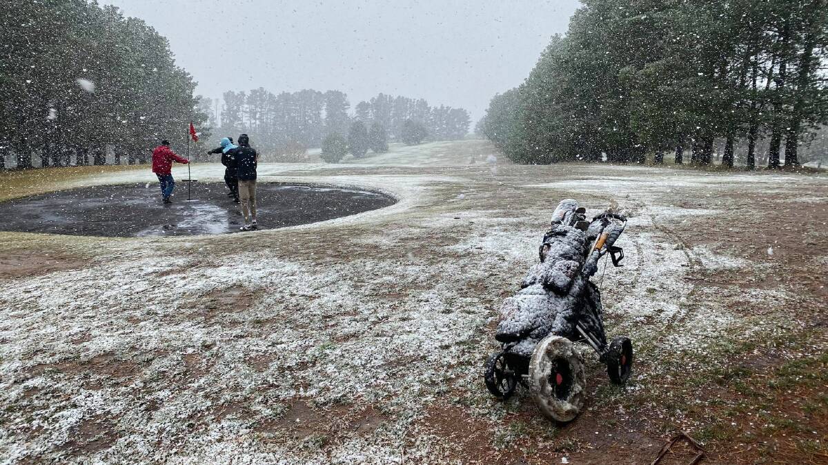 FANCY A ROUND? Some hardy golfers took to the Bombala fairways on Saturday - although they only lasted four holes before retiring to the 19th. Photo: James Tatham