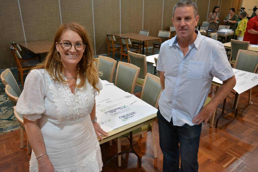 Merimbula Town Summit facilitator Jo Kelly and Chamber of Commerce president Nigel Ayling review lists of priorities workshopped during the two-day event. Photo: Ben Smyth