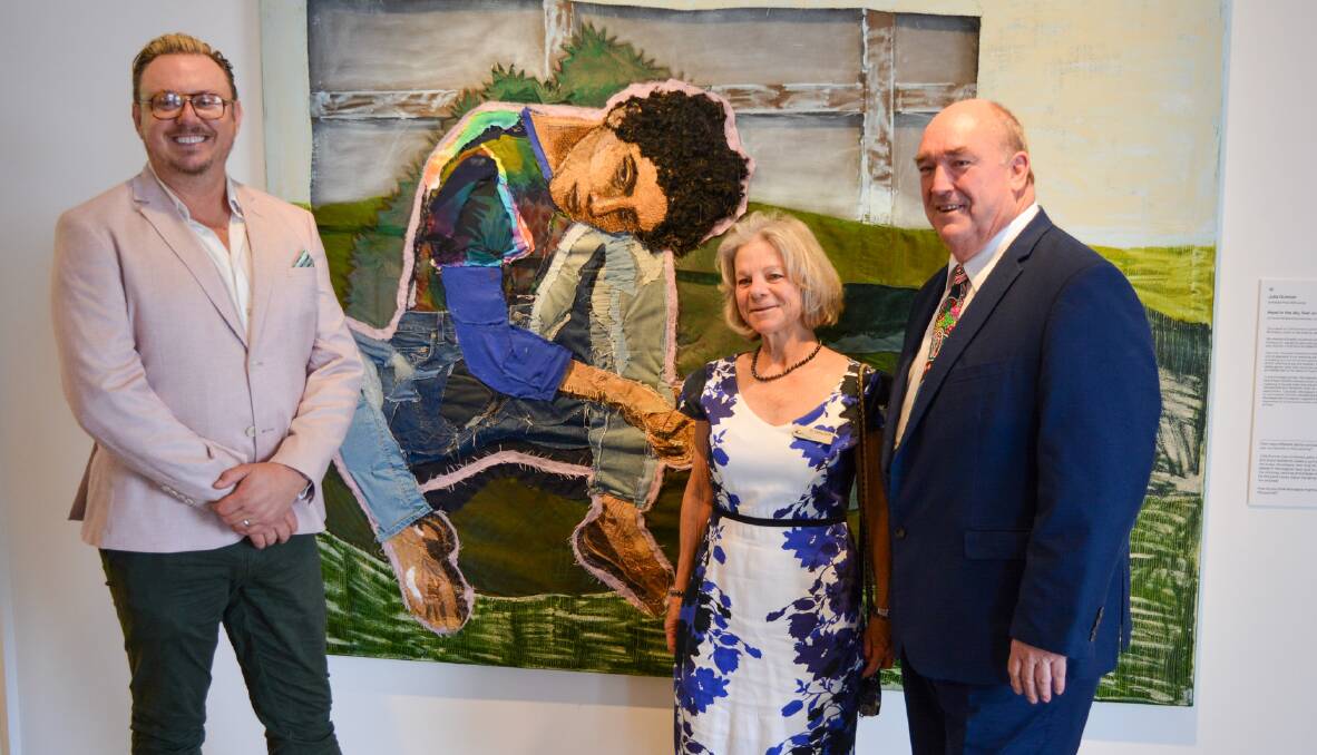 SECCA director Iain Dawson with deputy mayor Cathy Griff and mayor Russell Fitzpatrick with the Archibald Prize-winning portrait by Julia Gutman. Picture by Ben Smyth