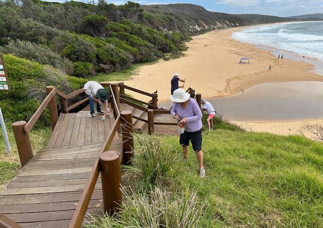 The steps at North Tura Beach are given a fresh coat of paint at a working bee on Sunday, February 11. Picture supplied