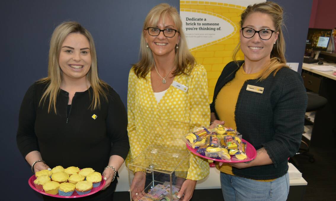 CommBank Merimbula's Courtney Powell, Jodie Heaton and Tammie Bastian host a morning tea last Friday to raise money for Can4Cancer. The Commonwealth Bank charity in 2018 raised more than $2million for breast, prostate, pancreatic and brain cancer research projects.