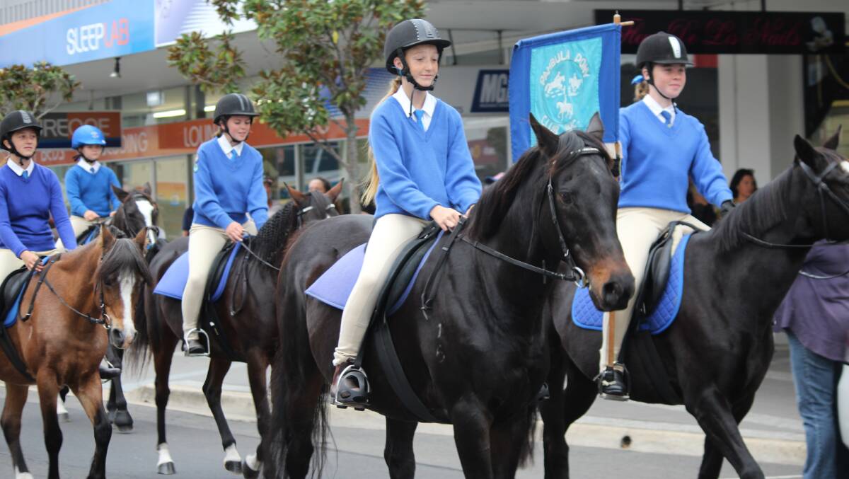 Members of Pambula Pony Club take part in the annual Bega Showground camp and parade along Carp St on Saturday.