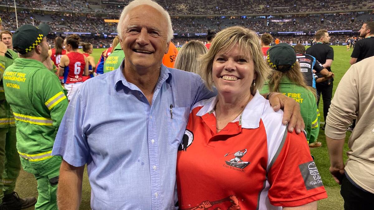 STALWART: Dave Boulton and Nicole Crowe in Melbourne earlier this year as part of an AFL tribute to bushfire-hit regions and emergency services. Photo: AFL NSW/ACT