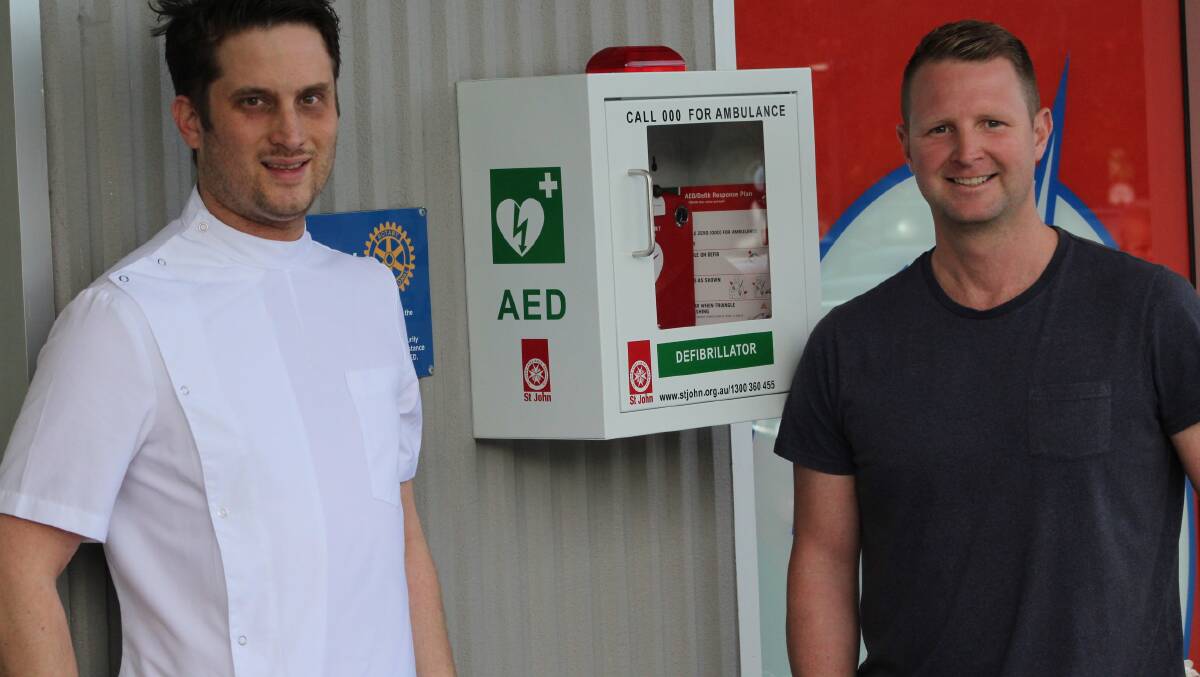 Pharmacist Matt Bottomley says he was only too happy to host the defibrillator on the external wall of the Tura Discount Chemist.
