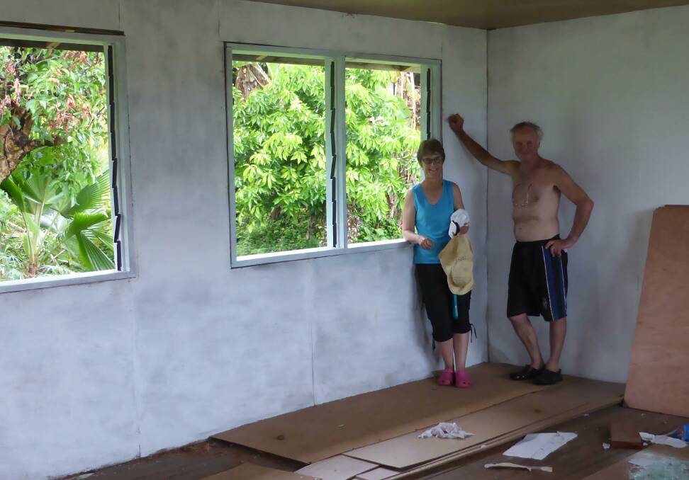 Ross and Ann Cooper help build a school during one of their regular trips to the Solomon Islands. Photo: Supplied