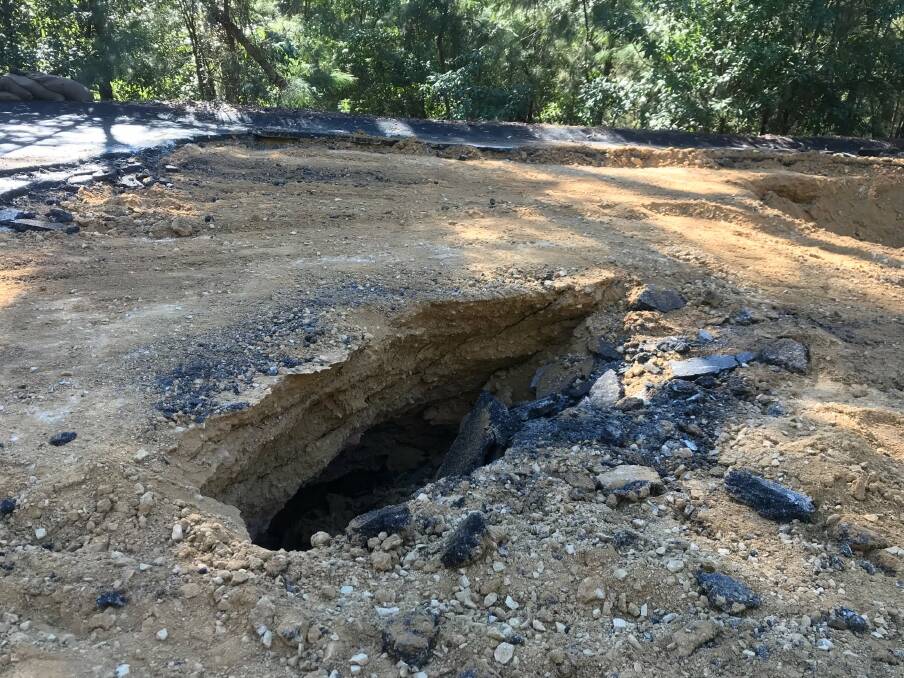 TRAFFIC HAZARD: Work is underway to repair a section of Merimbula Drive after a sinkhole opened up following heavy rains recently. Photo: BVSC